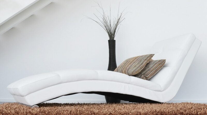 Deco white chaise, a wonderful place to lounge and read the OHG Realty policies that protect you.